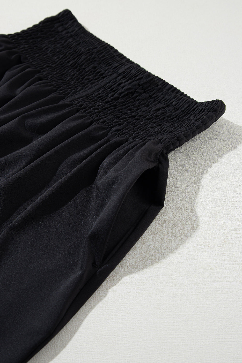 Black Pocketed Smocked High Waist JoggersMaterial:95%Polyester+5%Elastane
These jogger pants are very cozy to wear with 95%Polyester+5%Elastane made
The smocked design adds a stylish touch a