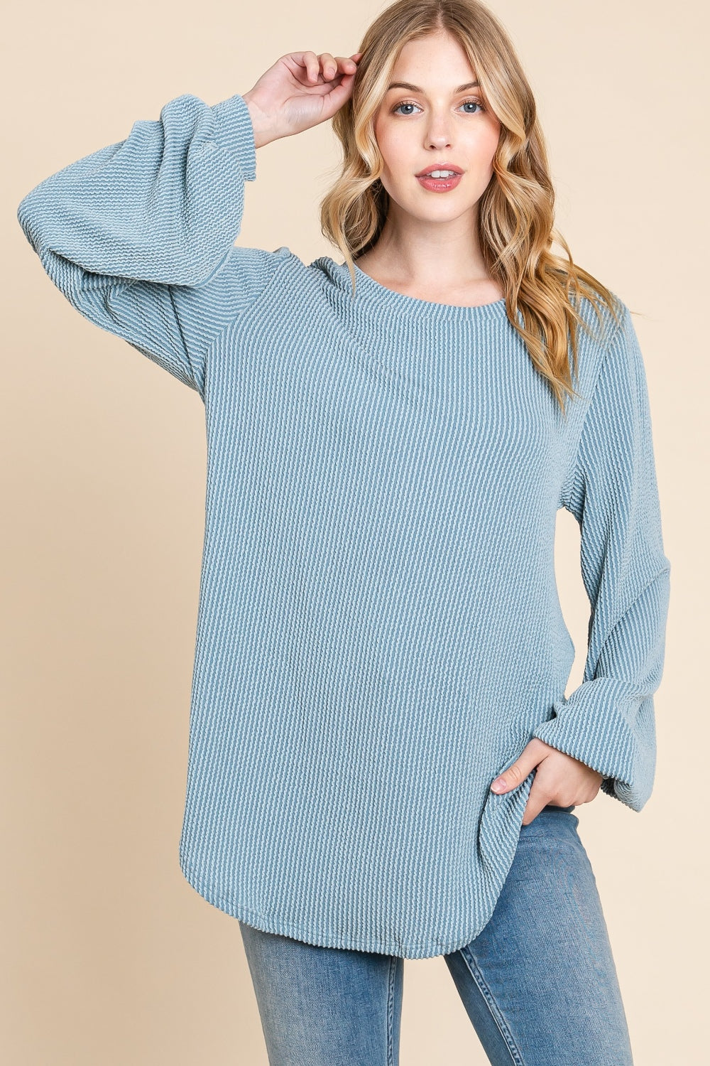 BOMBOM Long Sleeve Curved Hem Ribbed T-ShirtThe Long Sleeve Curved Hem Ribbed T-Shirt is a versatile and essential piece for your wardrobe. Its ribbed texture adds a unique touch to the classic design. The cur