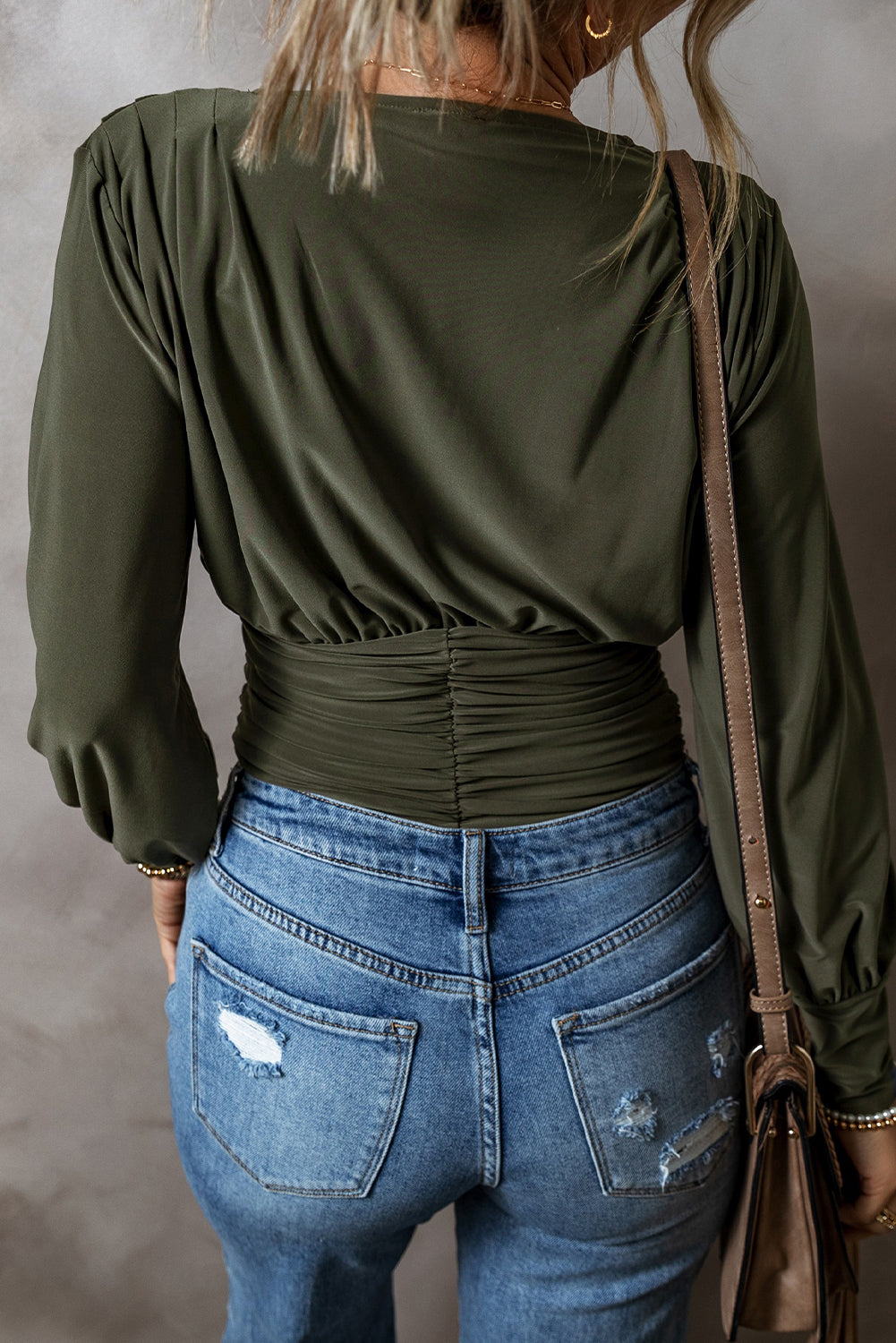 Moss Green Wrap V Neck Ruched Long Sleeve BodysuitMaterial:85%Polyester+15%Elastane
• Elevate your wardrobe with the bodysuit, featuring a flattering ruched design that accentuates your curves effortlessly.
• Emb