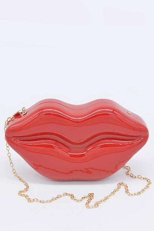 Lips Clutch BagLength - 8.5" Width - 2.25" Height - 4.5" Shoulder Chain Included Composition - Polyurethane & Mix Metals Lead & Nickel Compliant