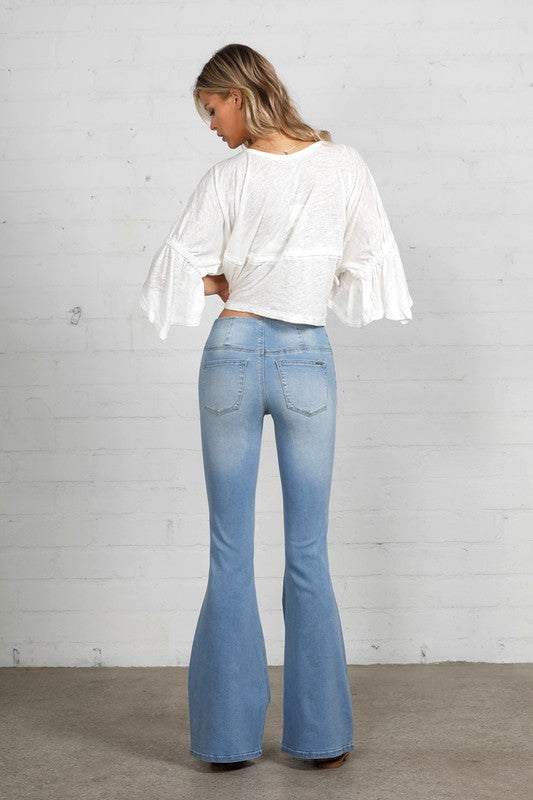 Mid Rise Banded Wide Flare JeansMid Rise Banded Wide Flare Jeans- 68% Cotton, 28% Polyester, 2% Rayon, 2% Spandex- Stretch Denim- Wide Flare Leg- Imported, Designed In USASize S- Waist 26 1/2"- Hip