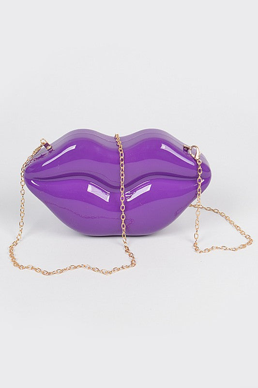 Lips Clutch BagLength - 8.5" Width - 2.25" Height - 4.5" Shoulder Chain Included Composition - Polyurethane & Mix Metals Lead & Nickel Compliant