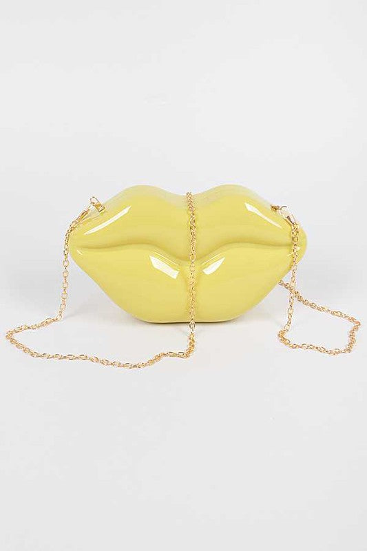 Lips Clutch BagLength - 8.5" Width - 2.25" Height - 4.5" Shoulder Chain Included Composition - Polyurethane & Mix Metals Lead & Nickel Compliant