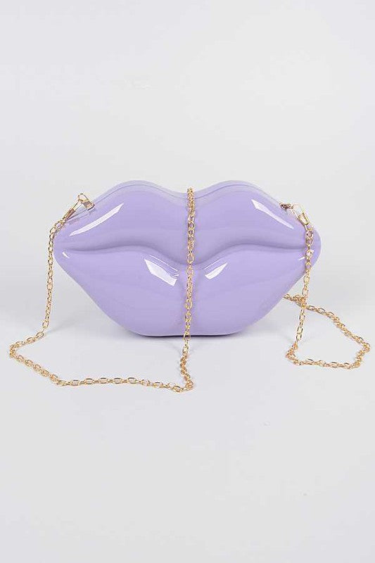 Lips Clutch BagLength - 8.5" Width - 2.25" Height - 4.5" Shoulder Chain Included Composition - Polyurethane & Mix Metals Lead & Nickel Compliant