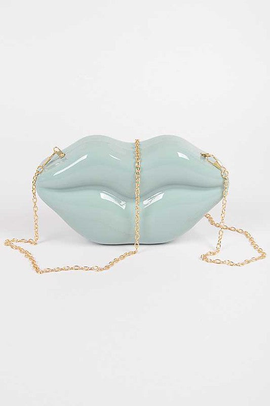 Lips Clutch BagLength - 8.5" Width - 2.25" Height - 4.5" Shoulder Chain Included Composition - Polyurethane & Mix Metals Lead & Nickel Compliant