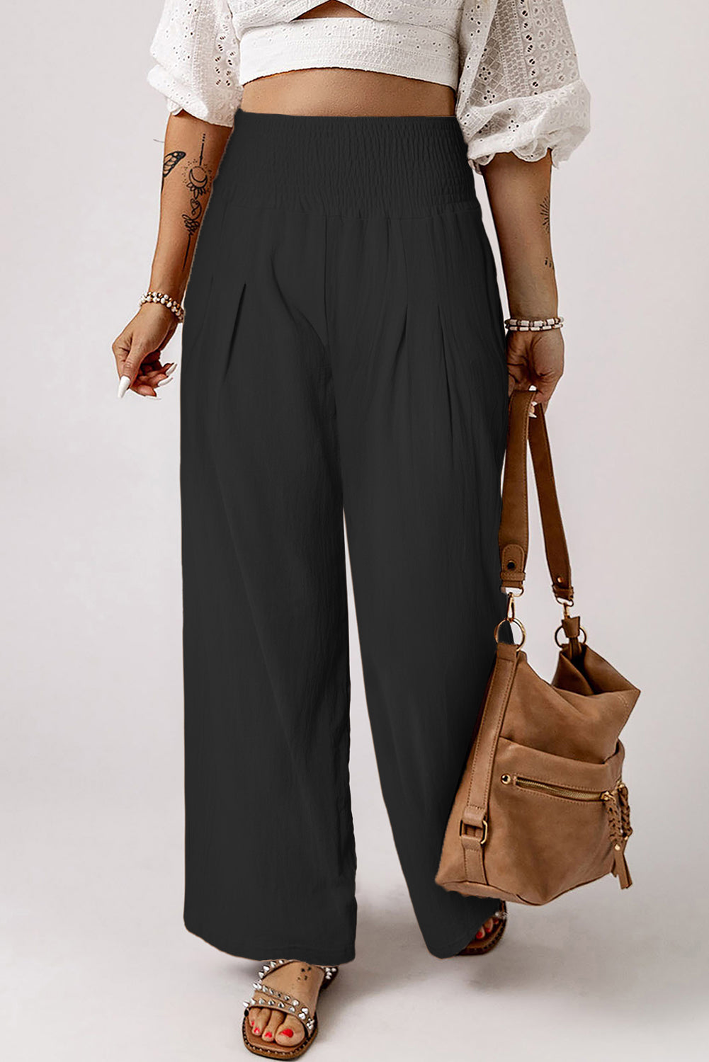 Black Smocked Wide Waistband High Waist Wide Leg PantsMaterial:65%COTTON+35%POLYESTER
Flattering smocked waistband cinches at the
waist for a lovely silhouette
High waist design elongates legs for a
st