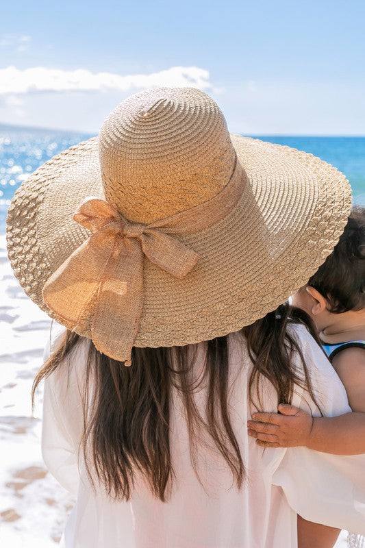 Scallop Edge Bow Accent SunhatScallop Edge Bow Accent Sunhat DetailsScallop edge designBurlap bow accentHat material: 100% strawBrim length: 5.5"Foldable & packableInside lining for all-day c