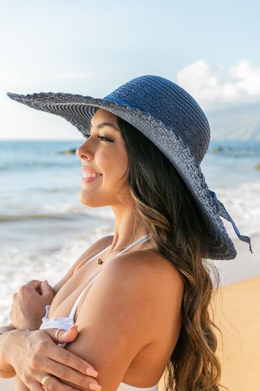 Scallop Edge Bow Accent SunhatScallop Edge Bow Accent Sunhat DetailsScallop edge designBurlap bow accentHat material: 100% strawBrim length: 5.5"Foldable & packableInside lining for all-day c