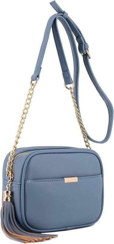 Tassel Small Crossbody Bag Camera BagTassel Small Crossbody Bag Camera Bag 8.75" (W) x 6.5" (H) x 3.25" (D) Tassel zipper Closure Adjustable Shoulder Strap with 22" min to 25" max drop Solid tone faux l