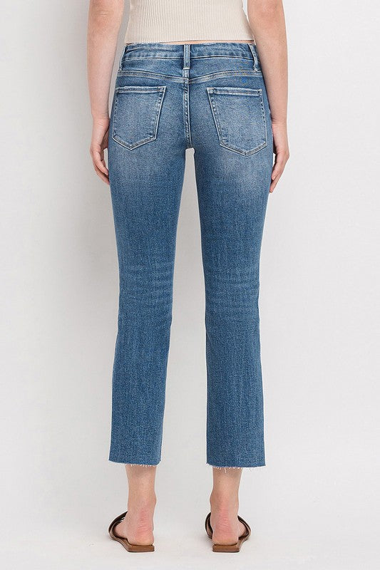Mid Rise Crop Slim Straight JeansThe Mid Rise Crop Slim Straight Jeans offer a modern take on a classic silhouette. Made from stretch denim, these jeans provide both comfort and style. With a mid-ri