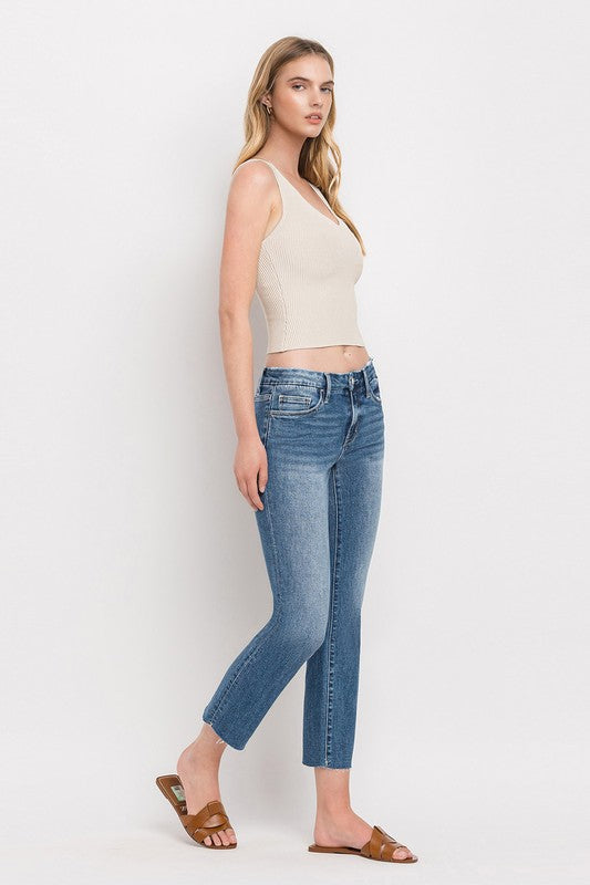 Mid Rise Crop Slim Straight JeansThe Mid Rise Crop Slim Straight Jeans offer a modern take on a classic silhouette. Made from stretch denim, these jeans provide both comfort and style. With a mid-ri