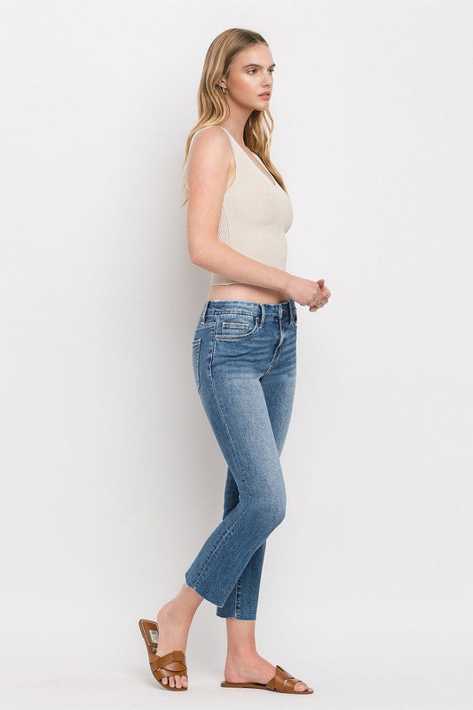Mid Rise Crop Slim Straight JeansThe Mid Rise Crop Slim Straight Jeans offer a modern take on a classic silhouette. Made from stretch denim, these jeans provide both comfort and style. With a mid-ri