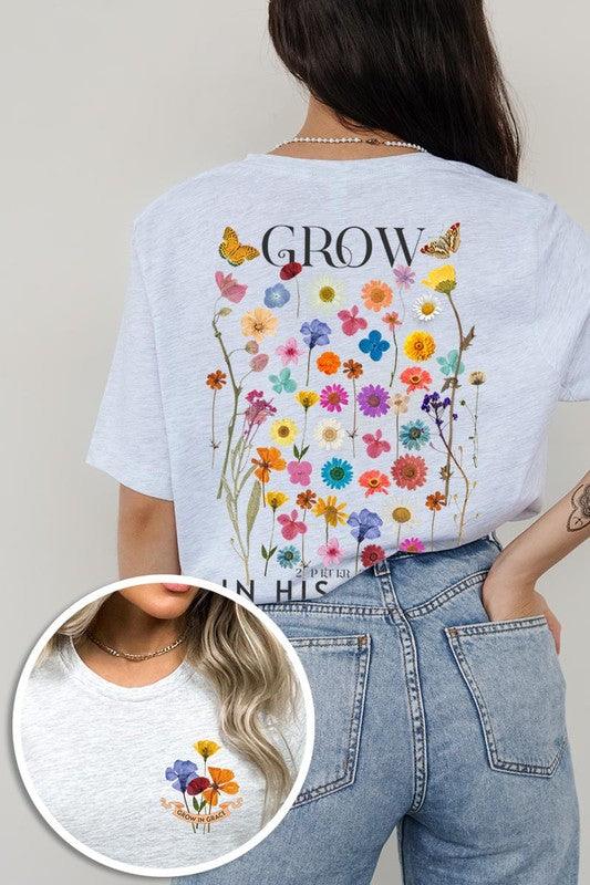Wild Flowers Grow In Grace Graphic TeeWild Flowers Grow In Grace Front and Back Graphic Tee.Unisex Crew Neck Short Sleeve Tees.Crafted from premium materials, tailored to your lifestyle, ensuring a comfo