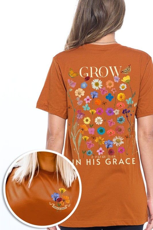 Wild Flowers Grow In Grace Graphic TeeWild Flowers Grow In Grace Front and Back Graphic Tee.Unisex Crew Neck Short Sleeve Tees.Crafted from premium materials, tailored to your lifestyle, ensuring a comfo