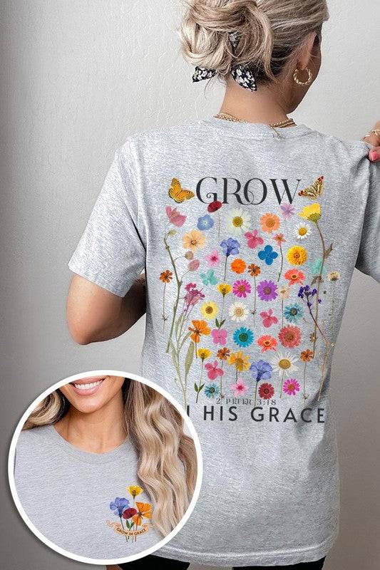 Wild Flowers Grow In Grace Graphic TeeWild Flowers Grow In Grace Front and Back Graphic Tee.Unisex Crew Neck Short Sleeve Tees.Crafted from premium materials, tailored to your lifestyle, ensuring a comfo