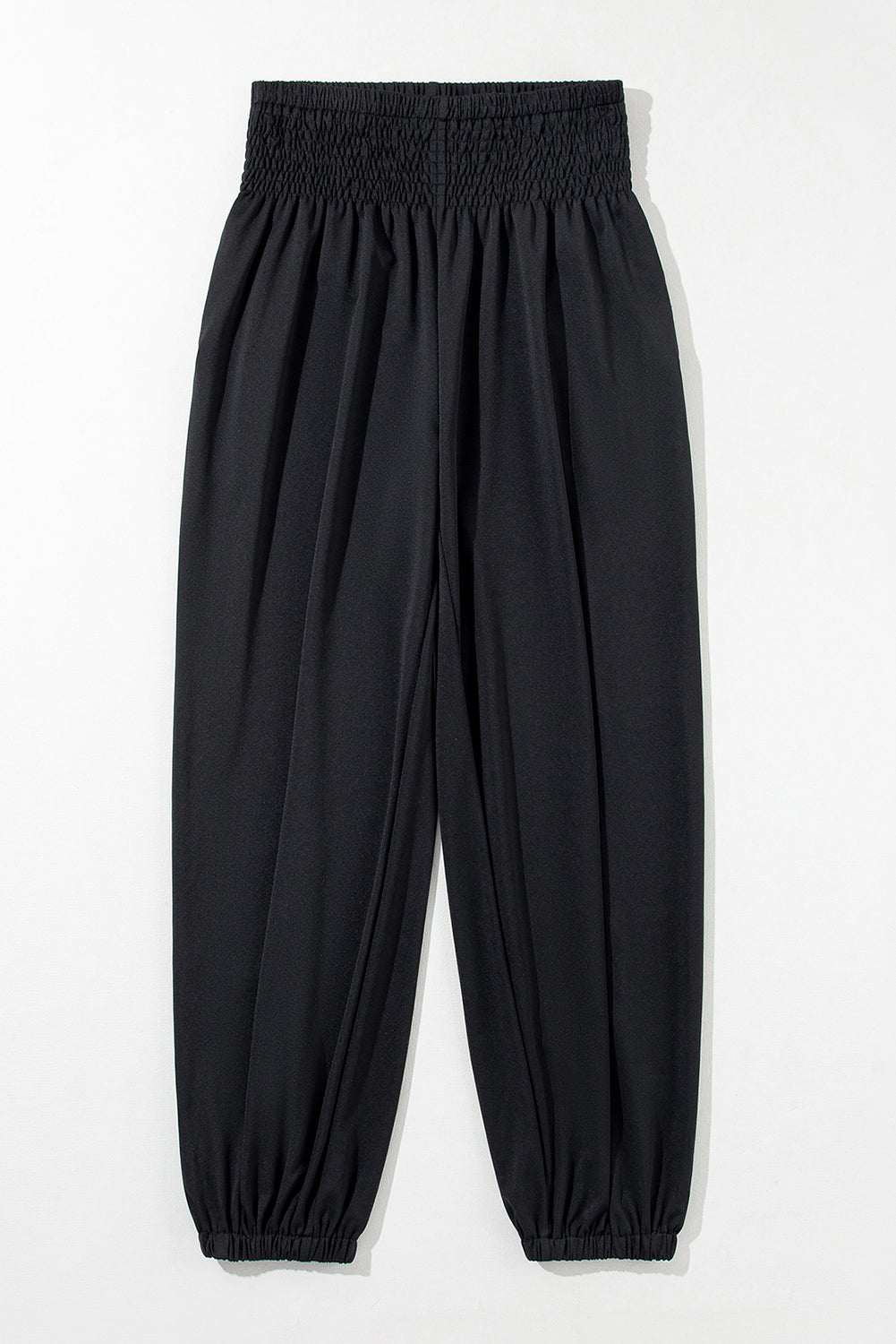 Black Pocketed Smocked High Waist JoggersMaterial:95%Polyester+5%Elastane
These jogger pants are very cozy to wear with 95%Polyester+5%Elastane made
The smocked design adds a stylish touch a