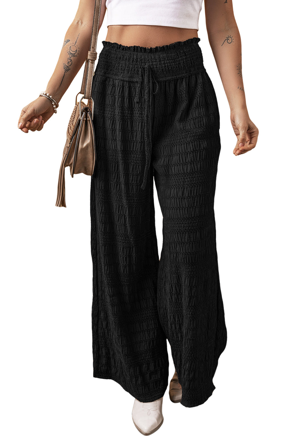Black Textured Wide Smocked Waist Loose PantsMaterial:66%Viscose+19%Polyester+15%Polyamide
• Effortlessly chic, the pants exude casual sophistication, perfect for both work and play.
• Crafted with a comfort