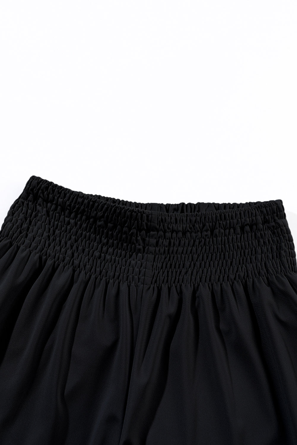 Black Pocketed Smocked High Waist JoggersMaterial:95%Polyester+5%Elastane
These jogger pants are very cozy to wear with 95%Polyester+5%Elastane made
The smocked design adds a stylish touch a