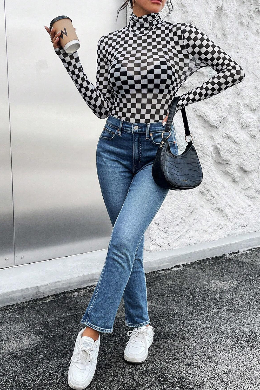 Black Checkered Print Long Sleeve Mock Neck BodysuitMaterial:95%Polyester+5%Elastane
• Embrace timeless style with our bodysuit, perfect for a casual yet chic look.• The mock neck design adds a touch of sophisticati