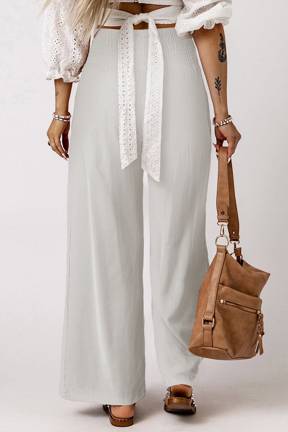 Black Smocked Wide Waistband High Waist Wide Leg PantsMaterial:65%COTTON+35%POLYESTER
Flattering smocked waistband cinches at the
waist for a lovely silhouette
High waist design elongates legs for a
st