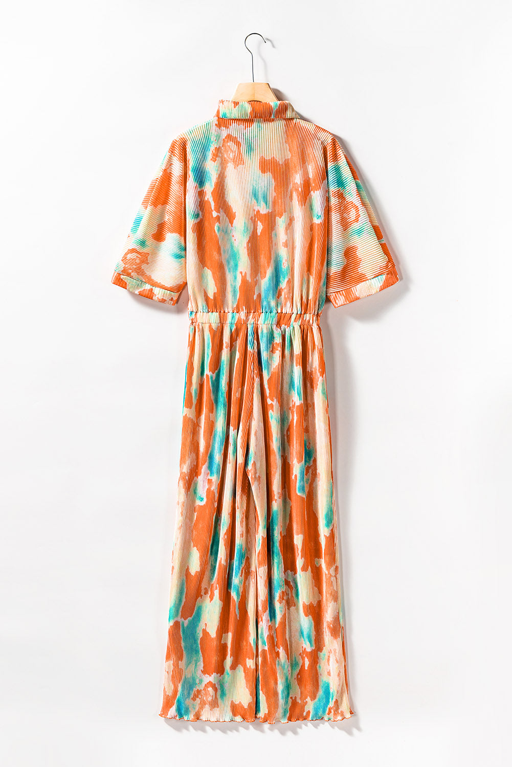 Multicolor Bohemian Tie Dye Pleated Wide Leg JumpsuitMaterial:100%Polyester
•Made of soft and flowy fabric for comfort and movement.
•Features a pleated design for a flattering fit.
•Wide leg c