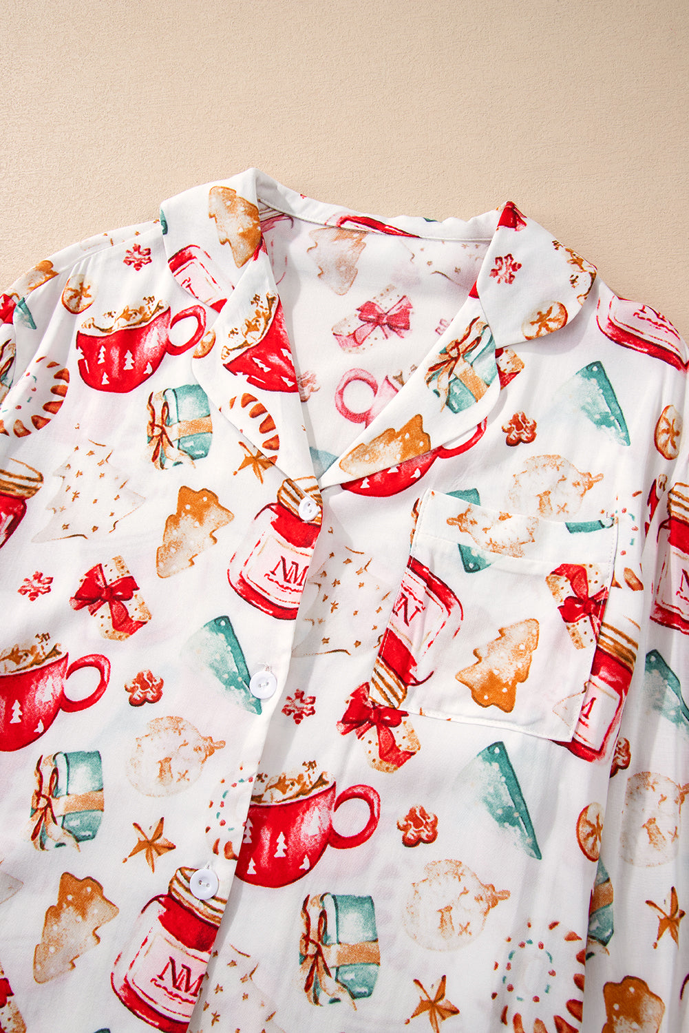 White Christmas Pattern Long Sleeve Shirt and Pants Pajama SetMaterial:100%Viscose
Festive Christmas pattern for a joyful holiday vibe.
Long sleeves provide warmth and comfort during the festive season.