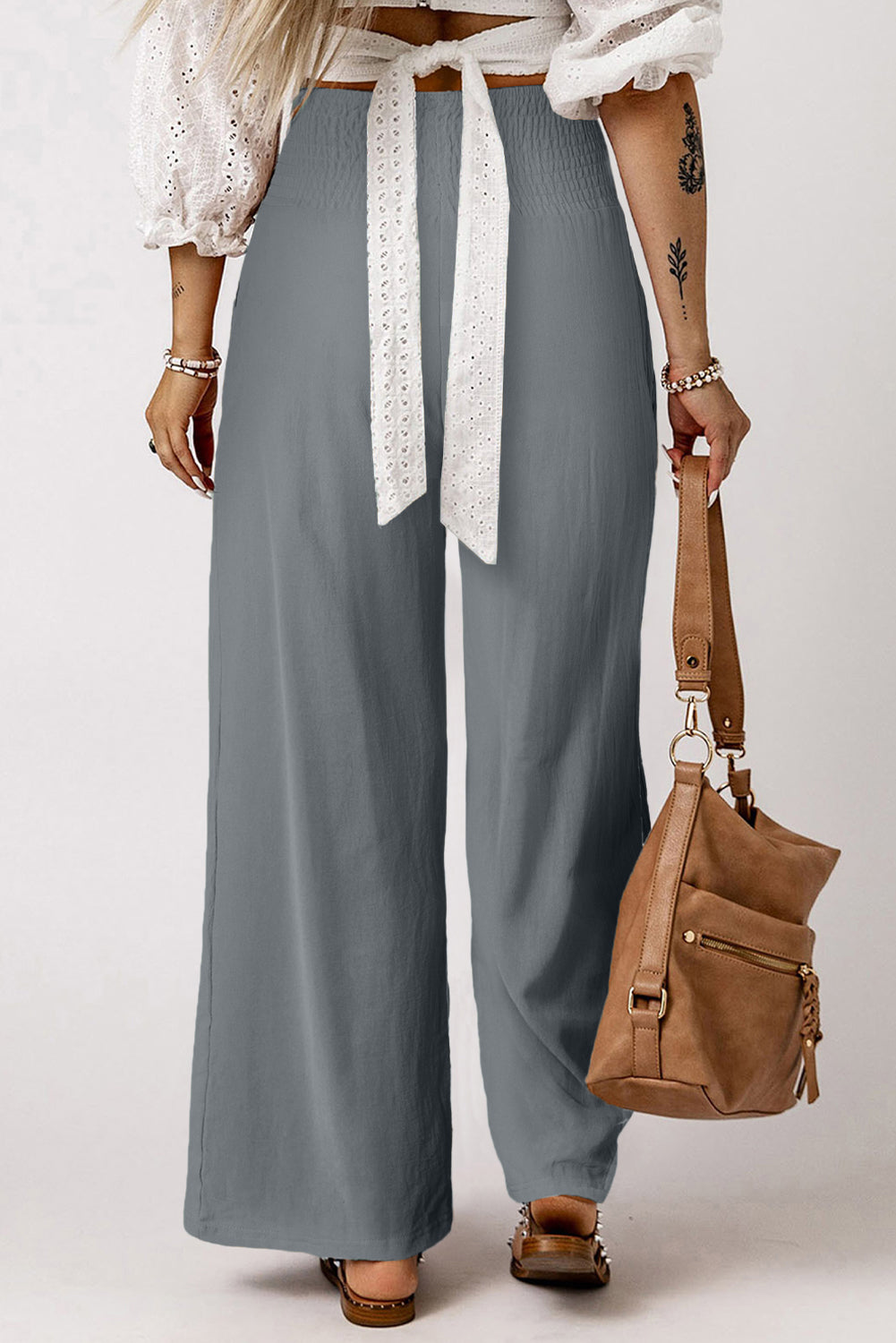 Black Smocked Wide Waistband High Waist Wide Leg PantsMaterial:65%COTTON+35%POLYESTER
Flattering smocked waistband cinches at the
waist for a lovely silhouette
High waist design elongates legs for a
st