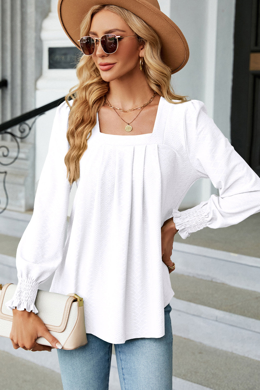 White Solid Color Textured Pleated BlouseMaterial:Polyester
• Effortlessly elegant, this blouse boasts a classic yet modern design that exudes sophistication.
• The textured fabric adds depth and interes