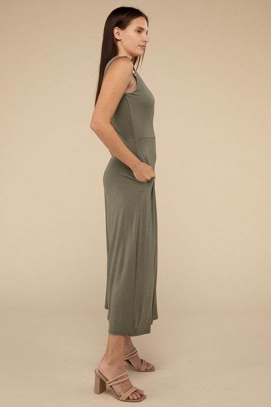 Surplice Neckline Sleeveless JumpsuitThe Surplice Neckline Sleeveless Jumpsuit exudes effortless elegance and modern sophistication. Featuring a surplice neckline, this jumpsuit offers a chic and flatte