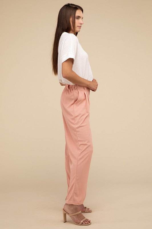 Waffle Trouser PantsElevate your everyday style with these waffle trouser pants. Crafted from textured waffle-knit fabric, they offer a perfect blend of comfort and sophistication. The