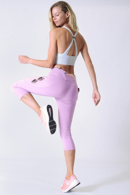 High Waist Tech Pocket Workout Capri LeggingsBetter than ever: Moisture wick performance fabric with 4-way stretch meets a new waistband that slims and stays in place! Three convenient pockets hold your phone,