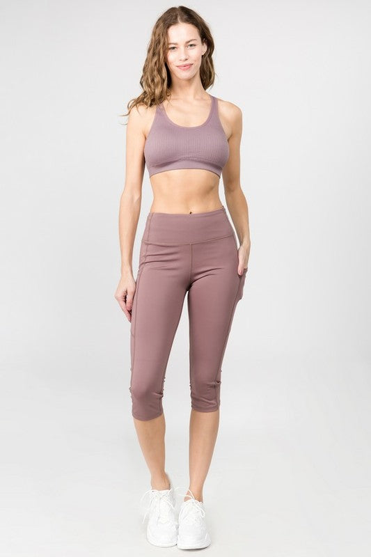 High Waist Tech Pocket Workout Capri LeggingsBetter than ever: Moisture wick performance fabric with 4-way stretch meets a new waistband that slims and stays in place! Three convenient pockets hold your phone,