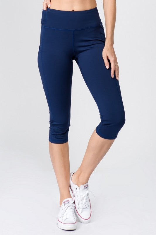 High Waist Tech Pocket Workout Capri LeggingsBetter than ever: Moisture wick performance fabric with 4-way stretch meets a new waistband that slims and stays in place! Three convenient pockets hold your phone,