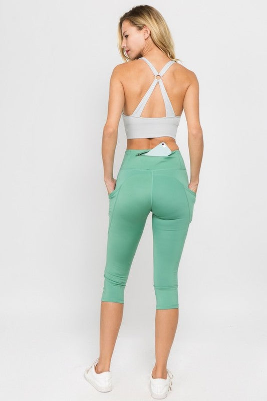 High Waist Tech Pocket Workout Capri LeggingsBetter than ever: Moisture wick performance fabric with 4-way stretch meets a new waistband that slims and stays in place! Three convenient pockets hold your phone,