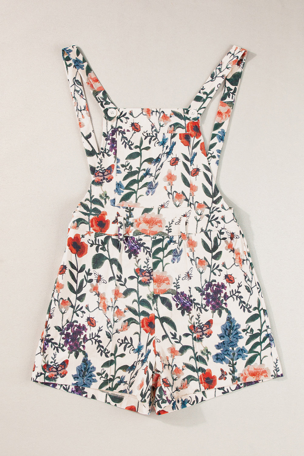 Beige Floral Print Bib Open Back RomperMaterial:100%Polyester
• Crafted in a charming beige floral print, this romper is perfect for summer outings, exuding a fresh and feminine vibe.
• Featuring a uni