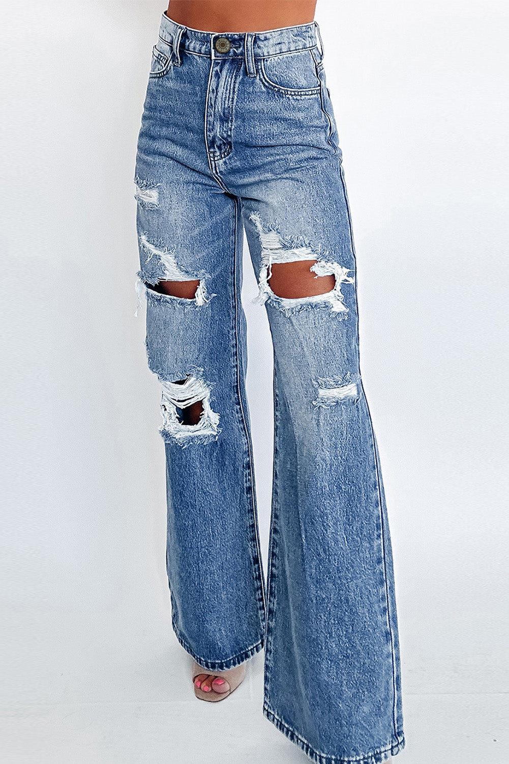 Ashleigh Blue Acid Wash Distressed Wide Leg High Waist JeansMaterial:93%Cotton+5%polyester+2%Elastane
• Distressed wide-leg jeans in a unique acid wash, perfect for a vintage look with a modern twist.
• High-waisted design