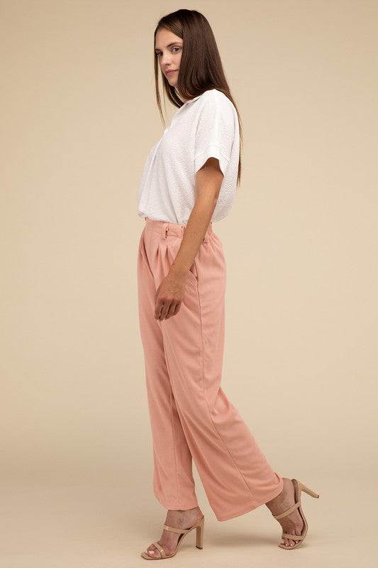 Waffle Trouser PantsElevate your everyday style with these waffle trouser pants. Crafted from textured waffle-knit fabric, they offer a perfect blend of comfort and sophistication. The