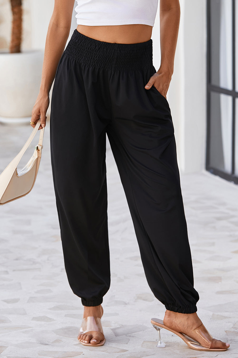 Black Pocketed Smocked High Waist JoggersMaterial:95%Polyester+5%Elastane
These jogger pants are very cozy to wear with 95%Polyester+5%Elastane made
The smocked design adds a stylish touch a