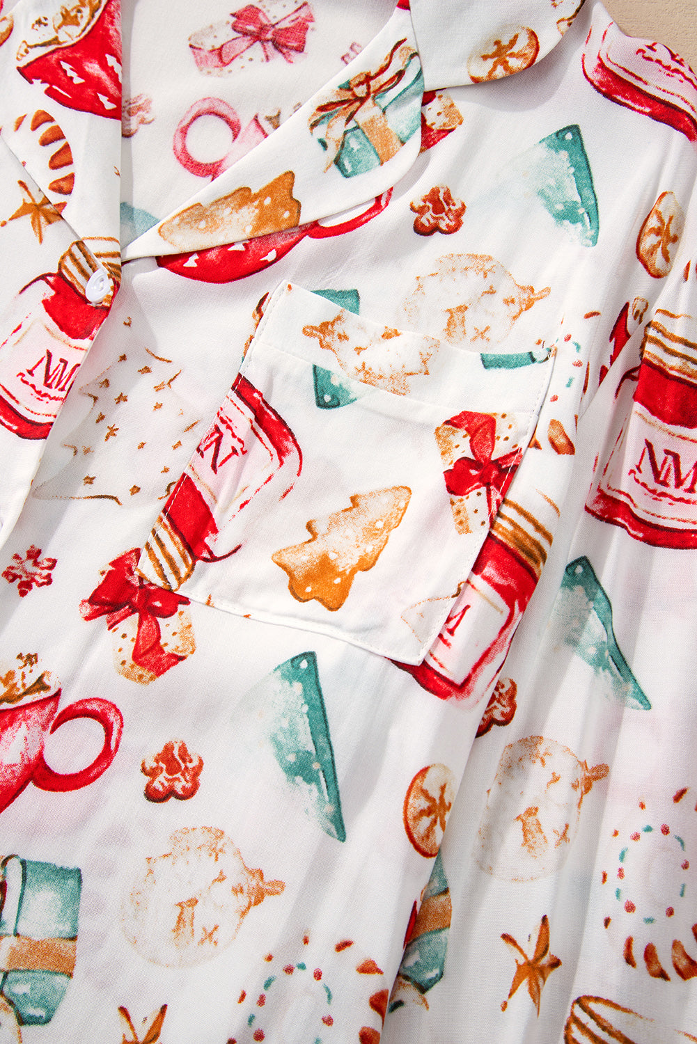 White Christmas Pattern Long Sleeve Shirt and Pants Pajama SetMaterial:100%Viscose
Festive Christmas pattern for a joyful holiday vibe.
Long sleeves provide warmth and comfort during the festive season.