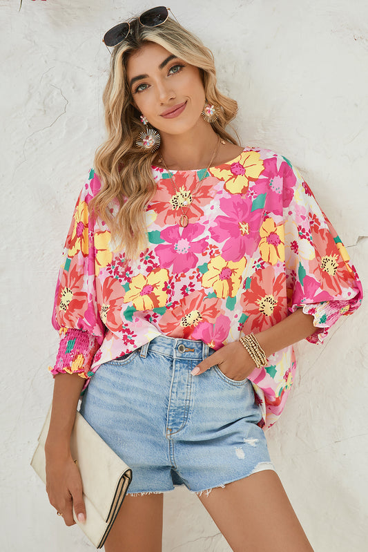 Pink Shirred Cuffs 3/4 Sleeve Boho Floral BlouseMaterial:100%Polyester



		The blouse is a stylish and feminine top featuring shirred cuffs and a boho-inspired floral print, adding a touch of bohemian charm to 