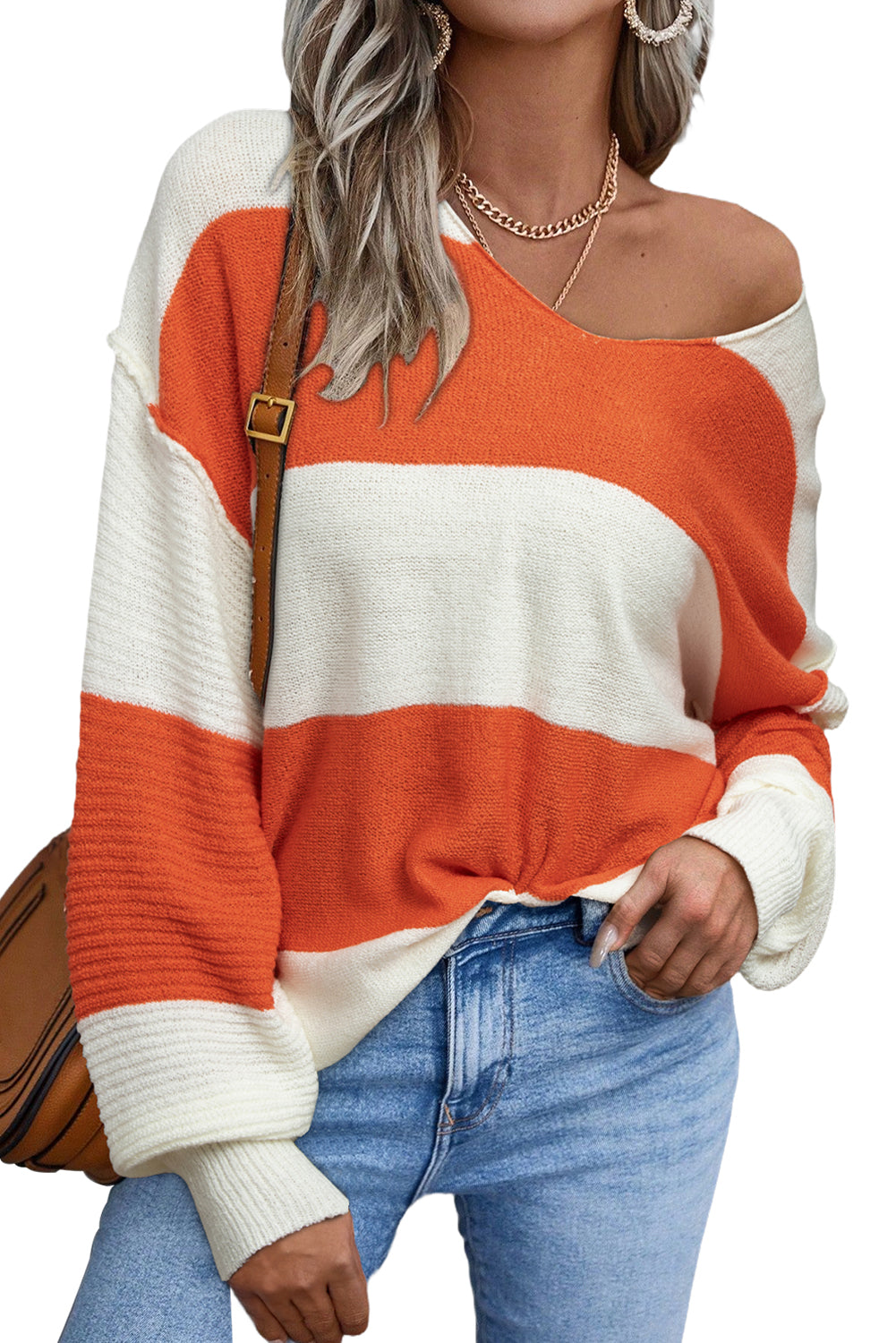 Orange Colorblock V Neck Side Slits SweaterMaterial:100%Acrylic

• Stand out in style with our sweater, blending casual stripes with a trendy rib-knit design.
• The vibrant orange hues add a pop of color to