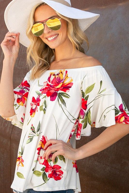 FLORAL OFF SHOULDER TOPFLORAL PRINT JERSEY ELASTICIZED OFF SHOULDER TOP- Floral off shoulder top- Elasticized off shoulder neckline- Ruffle short sleeves- Loose fit- Allover floral print j