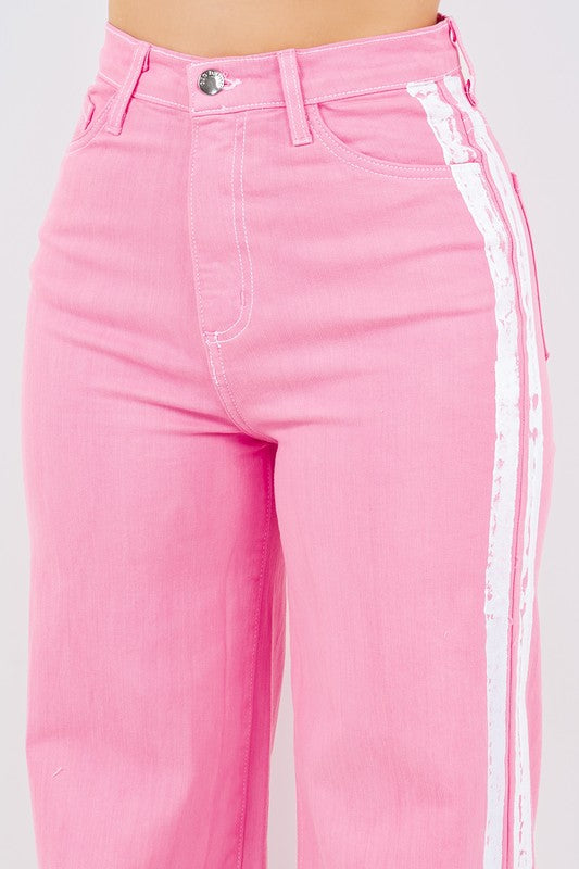 Striped Jean in PinkStep up your denim game with our Striped Wide Leg Jean in Pink! These stylish pants feature a high rise fit, front and back pockets, and a front button and zipper cl