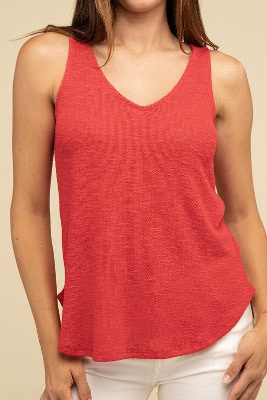 V Neck Sleeveless Cami TopThe V Neck Sleeveless Cami Top is a chic and versatile addition to any wardrobe. Featuring a flattering V neckline and a sleeveless design, this cami top is perfect 