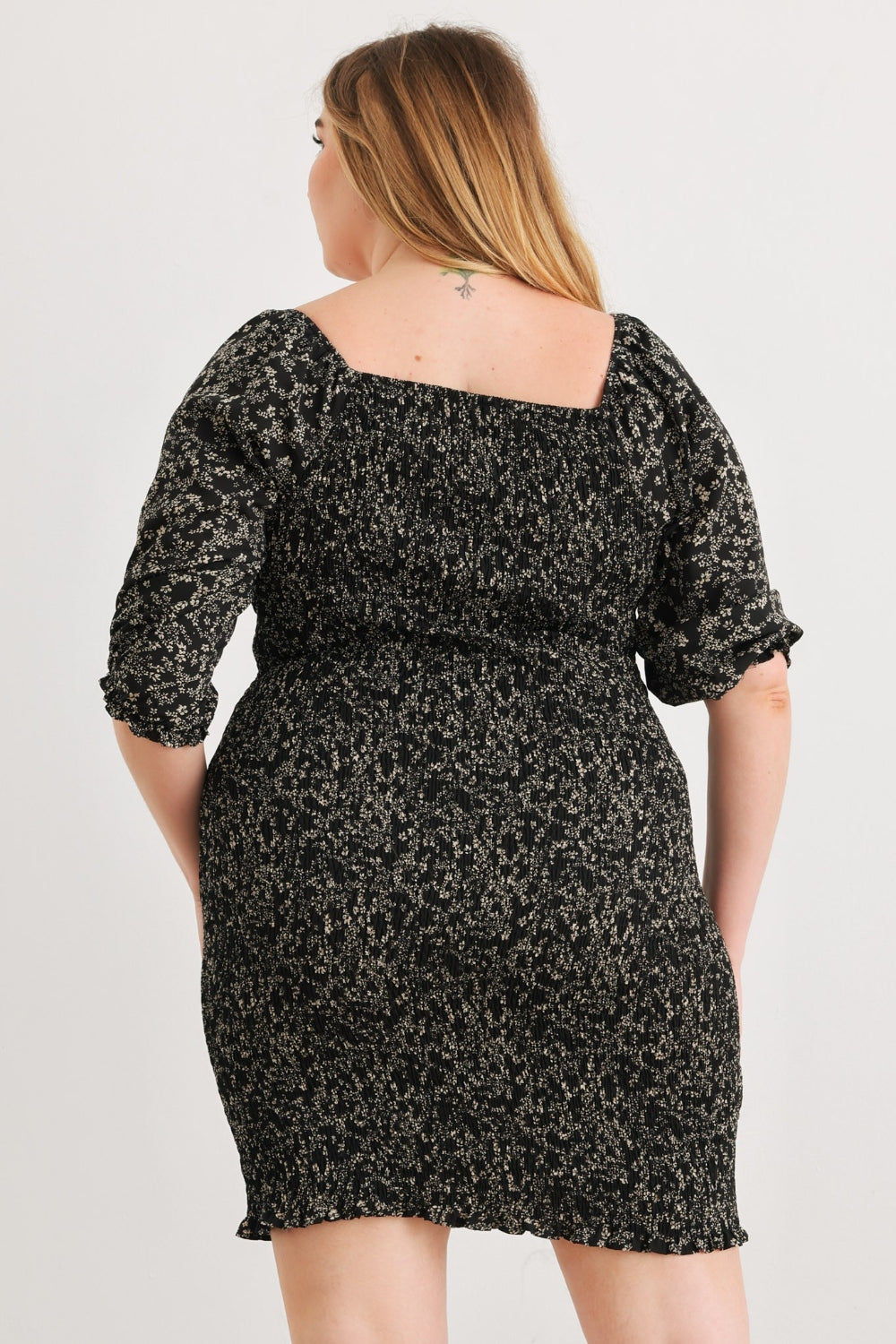 Zenobia Plus Size Smocked Printed Square Neck Mini DressSmocked Printed Square Neck Mini Dress is a trendy and feminine choice for any occasion. The square neckline adds a touch of elegance, while the smocked detailing en