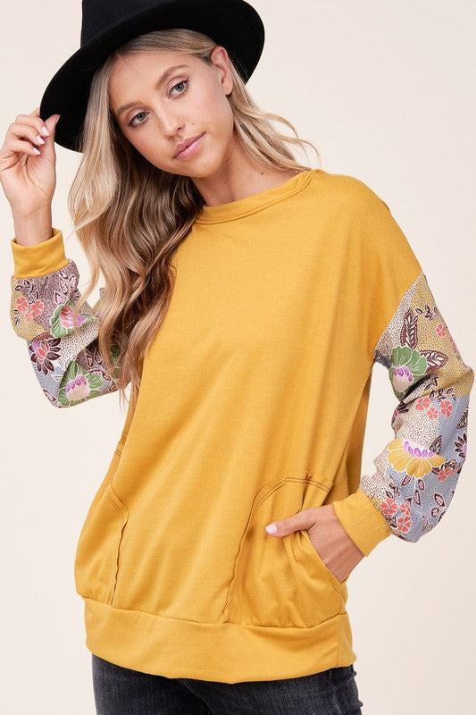 WOVEN FLORAL MIXED TOPFRENCH TERRY SOLID AND WOVEN FLORAL PRINT MIXED LONG SLEEVE SIDE POCKET RAW EDGE DETAIL TOP - MADE IN U.S.A.
Style: Casual
Print / Pattern: SOLID AND WOVEN FLORAL 
F