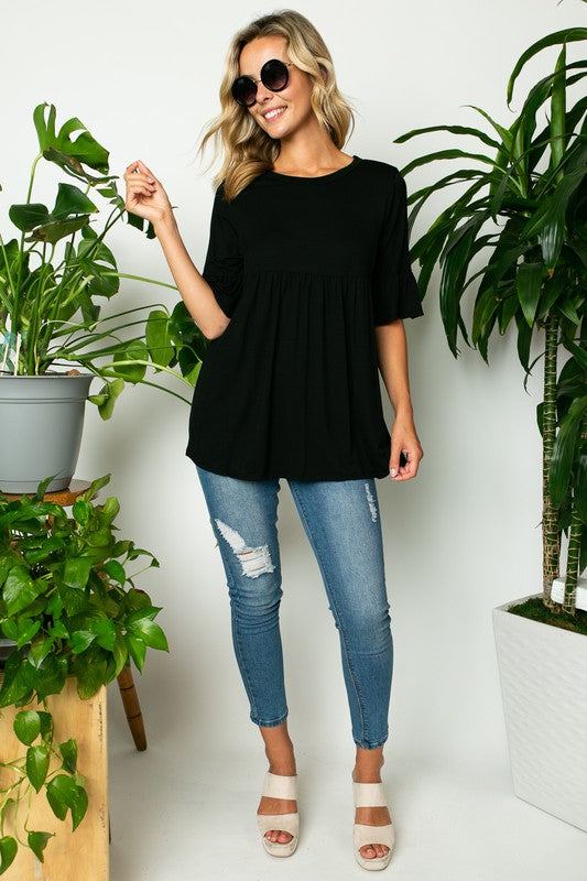 PLUS SOLID RUFFLE SLEEVE LOOSE TOPSOLID JERSEY ROUND NECK HALF RUFFLE SLEEVE LOOSE FIT PLUS TOP95% RAYON, 5% SPANDEX MADE IN USA1X/2X/3X 2-2-2
Style: Casual
Print / Pattern: SOLID
Fit: LOOSE FIT 
Nec