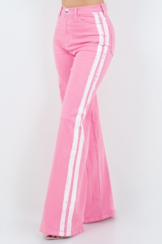 Striped Jean in PinkStep up your denim game with our Striped Wide Leg Jean in Pink! These stylish pants feature a high rise fit, front and back pockets, and a front button and zipper cl