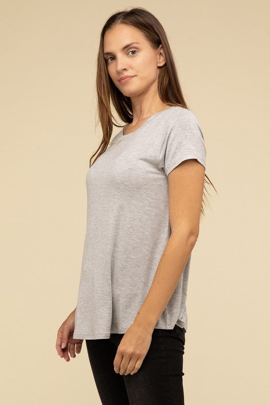 Flowy Round Hem Rayon Short Sleeve TopThe Flowy Round Hem Rayon Short Sleeve Top is the perfect addition to your casual wardrobe. Crafted from soft, lightweight rayon, this top features a relaxed fit and