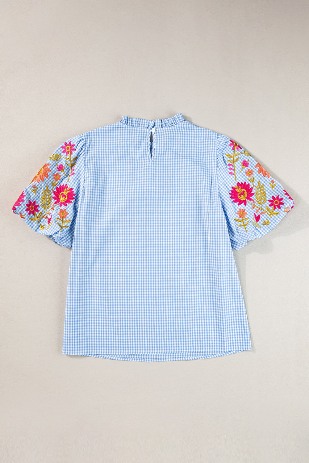 Light Blue Flower Embroidered Puff Sleeve Gingham BlouseMaterial:100%Cotton

• Elevate your casual look with our blouse, featuring intricate floral embroidery on a classic gingham pattern.
• The puff sleeves add a touch